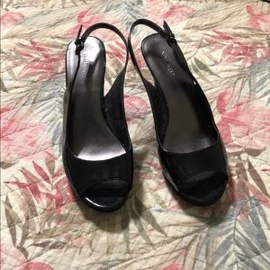 Black open toe sling back heels.